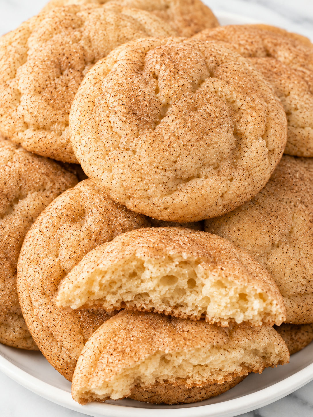Soft cinnamon cream cheese cookies with a broken tender center