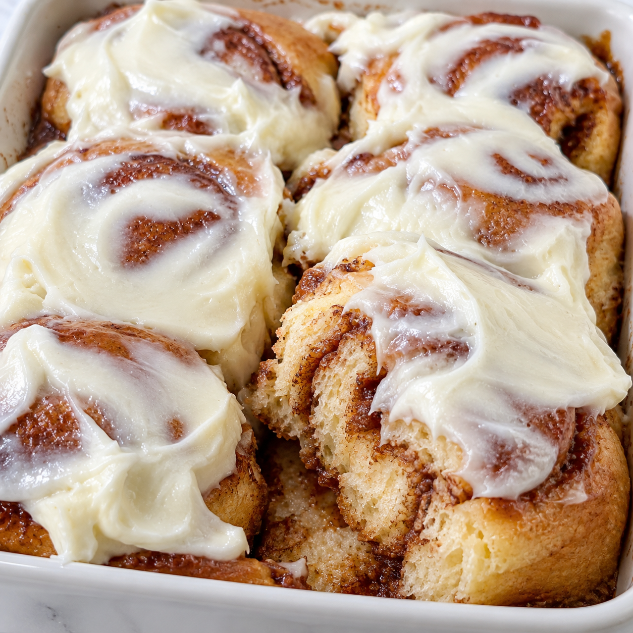 Cinnamon Roll Bliss Bars with cream cheese frosting and cinnamon swirls