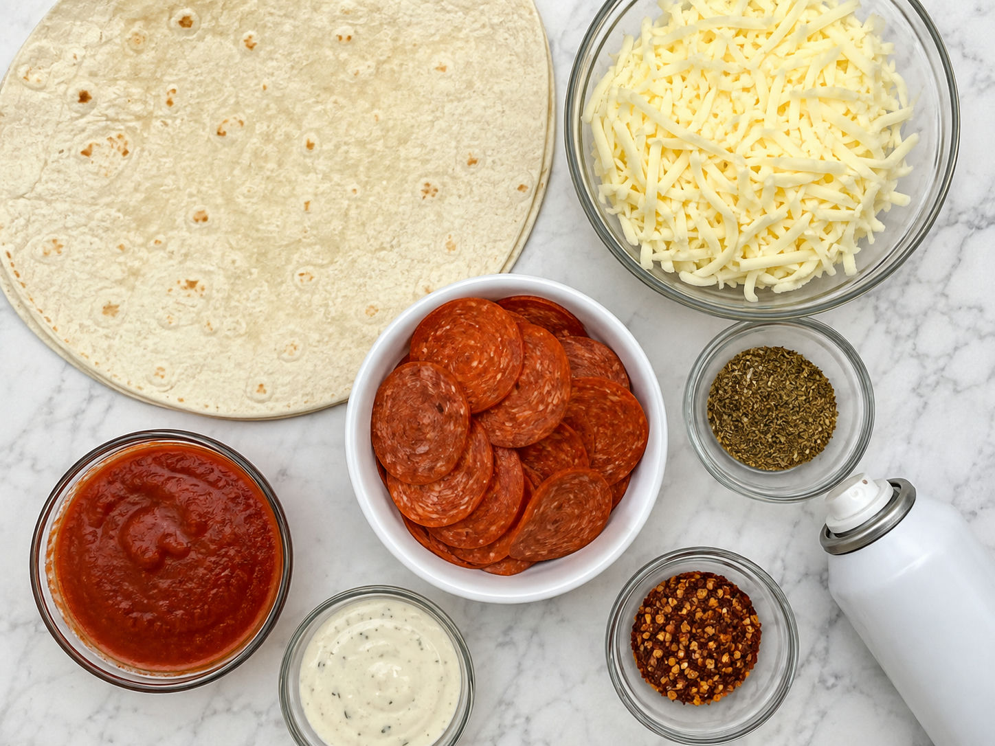 Ingredients for a pepperoni mozzarella pizzadilla with tortilla and sauce
