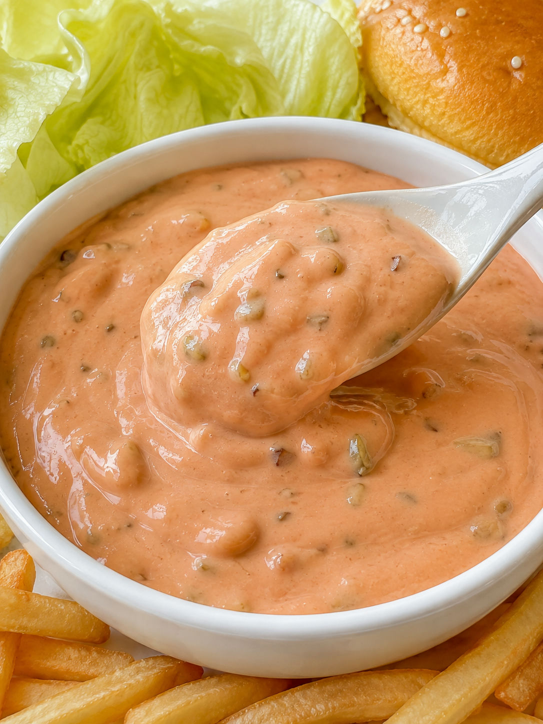 Creamy Thousand Island dressing with fries and crisp lettuce