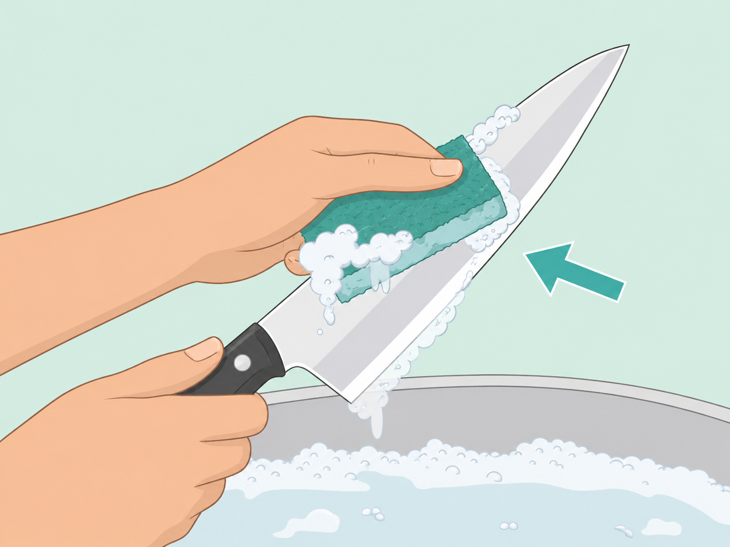 A chef knife being carefully washed by hand.