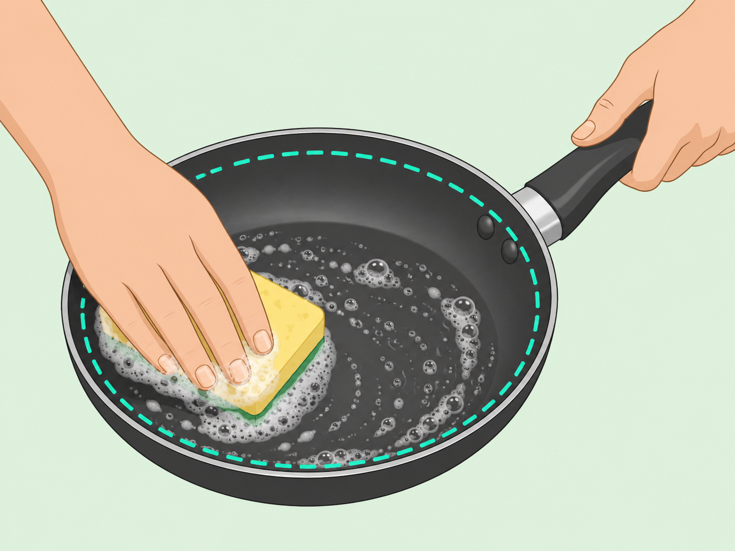 A nonstick pan being washed gently with a soft sponge.
