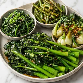 Asian green vegetable sides with gai lan, spinach, green beans, and bok choy