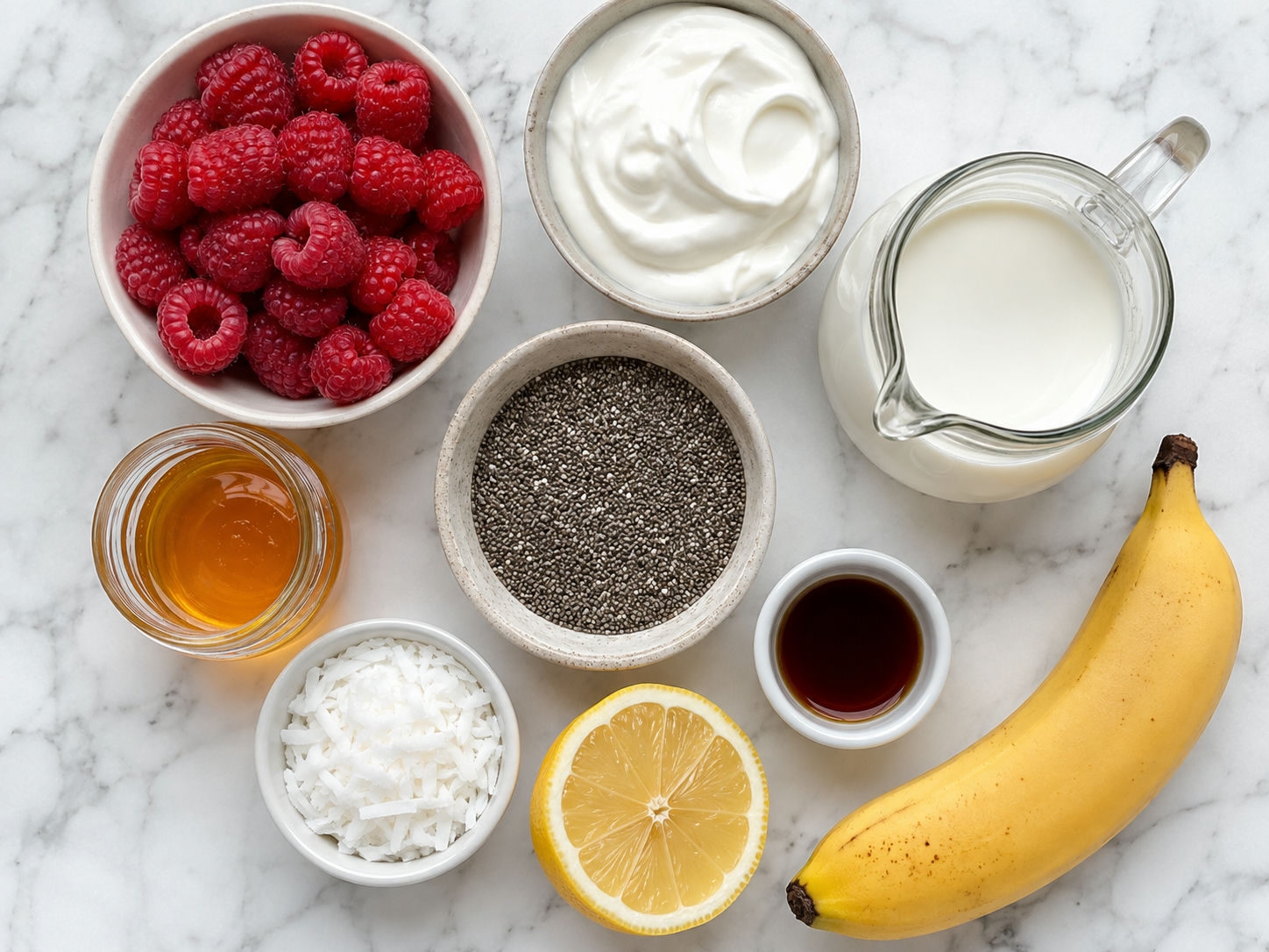 Raspberries, chia seeds, yogurt, milk, banana, coconut, and honey