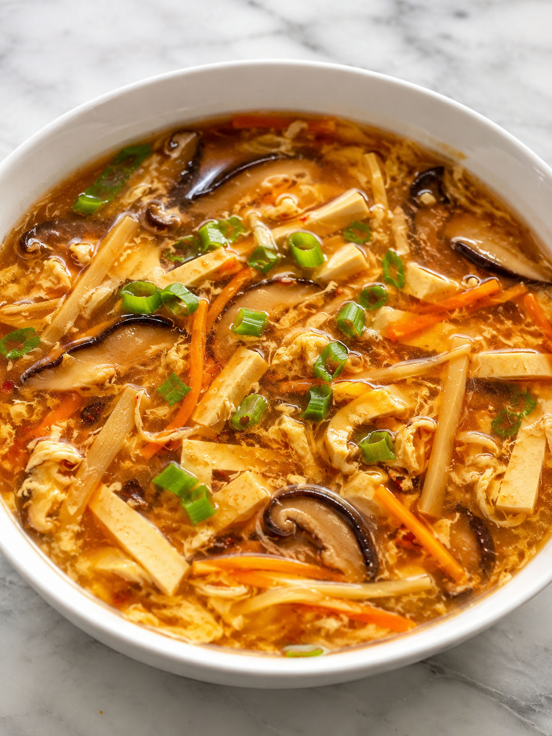 Four cooking steps for hot and sour soup from slicing to egg ribbons